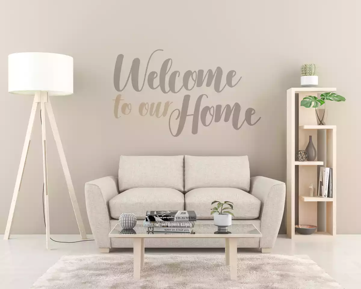 Pared decorada con el texto Welcome to our home